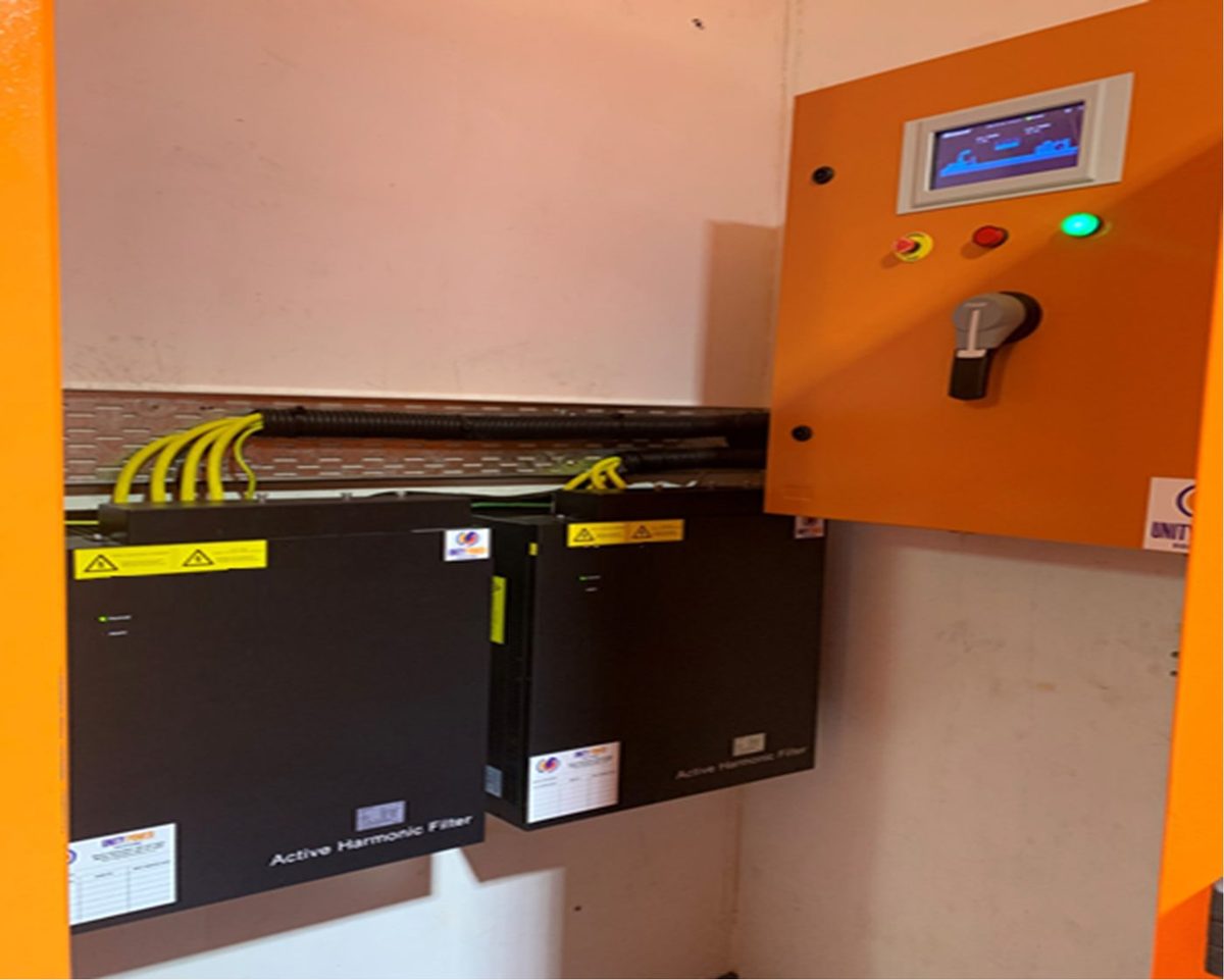 Sinexcel active harmonic filters installed on a wall beside a distribution board
