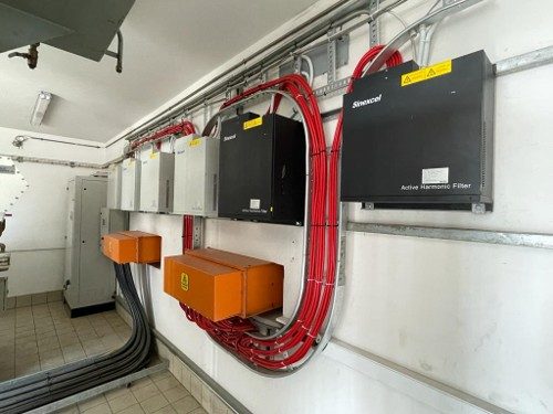 Wall-mounted Sinexcel active harmonic filters on site